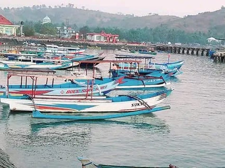 The jukung fishing fleet moored in Awang harbour at first light