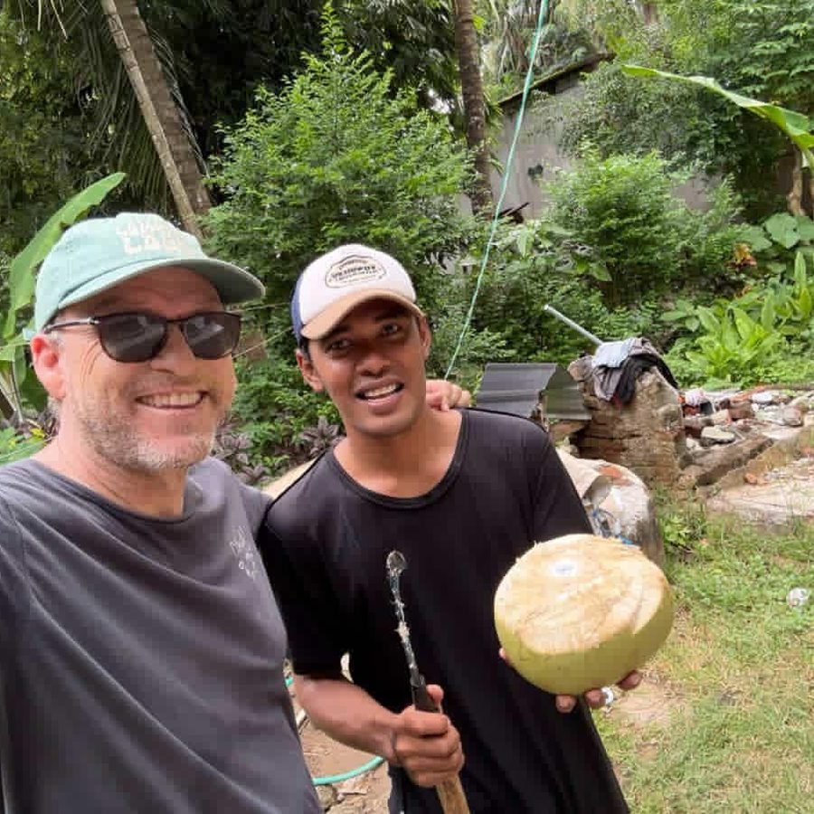 The crew back on dry land, coconut in hand